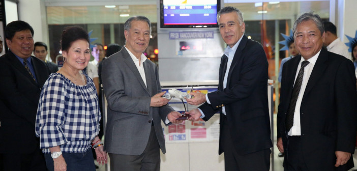 PAL FLIES TO NEW YORK VIA VANCOUVER. Philippine Airlines Chairman & Chief Executive Officer Dr. Lucio C. Tan presents a Boeing 777 model aircraft to US Ambassador to the Philippines Philip Goldberg during the March 15, 2015 send-off ceremony of the airline’s inaugural flight to New York. Also in photo are Transportation Undersecretary Jose P. Lotilla, Mrs. Carmen Tan and PAL President & Chief Operating Officer Jaime J. Bautista (right).